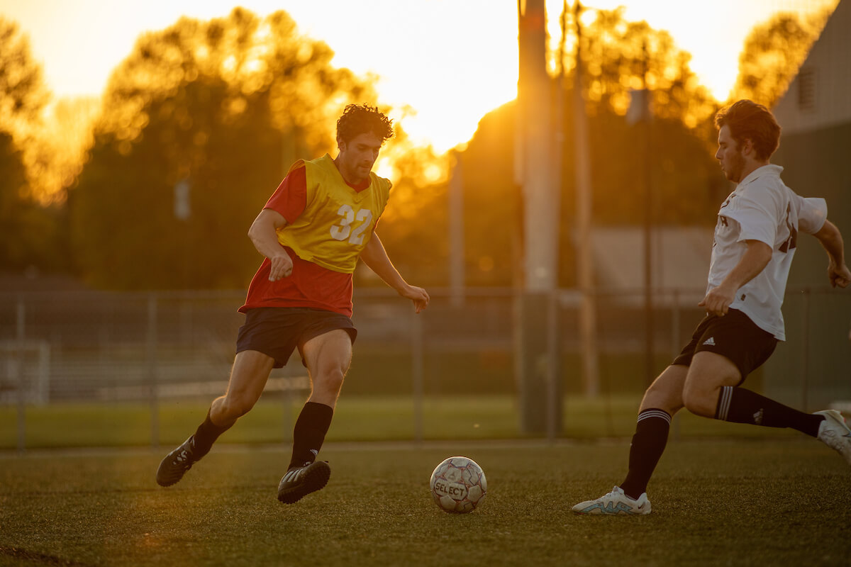 students play intramural soccer